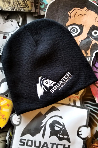 8" Beanie - 100% Acrylic Knit with SQUATCH Industries Logo in White embroidered on the front.