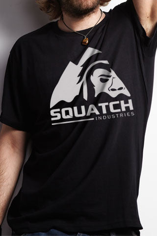 SQUATCH INDUSTRIES Tee. The First and Original White on Black Tee. Original SQUATCH Industries Logo.   Product Description •Artwork by Steve Lovitt, Squatch Industries Design  •Screen Printed Graphic Tee White on Black •Premium Next Level Short-Sleeve Crew (Black) •100% Combed Cotton Jersey •Available in Small - XL